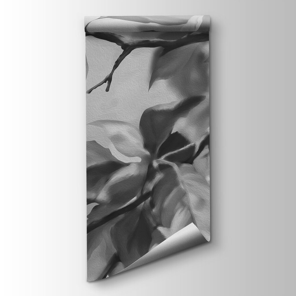Black and white image of a tree branch with leaves